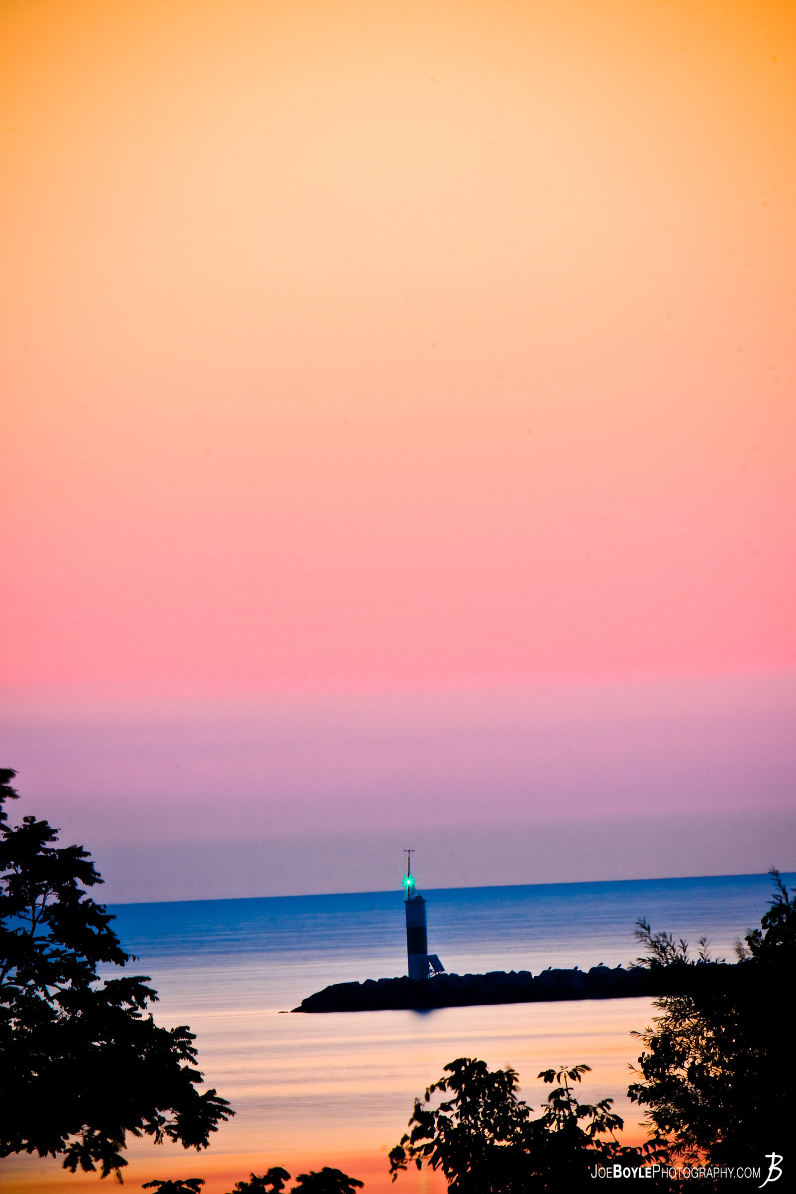  This picture was taken near Cleveland Ohio and features the Lighthouse for the Cleveland Yacht Club. Captured early in the morning, the colors that were available are truly astounding! 